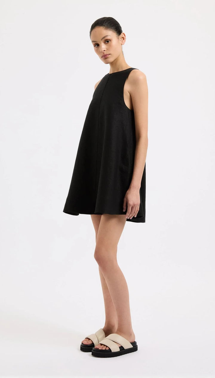 Black sleeveless mini dress.