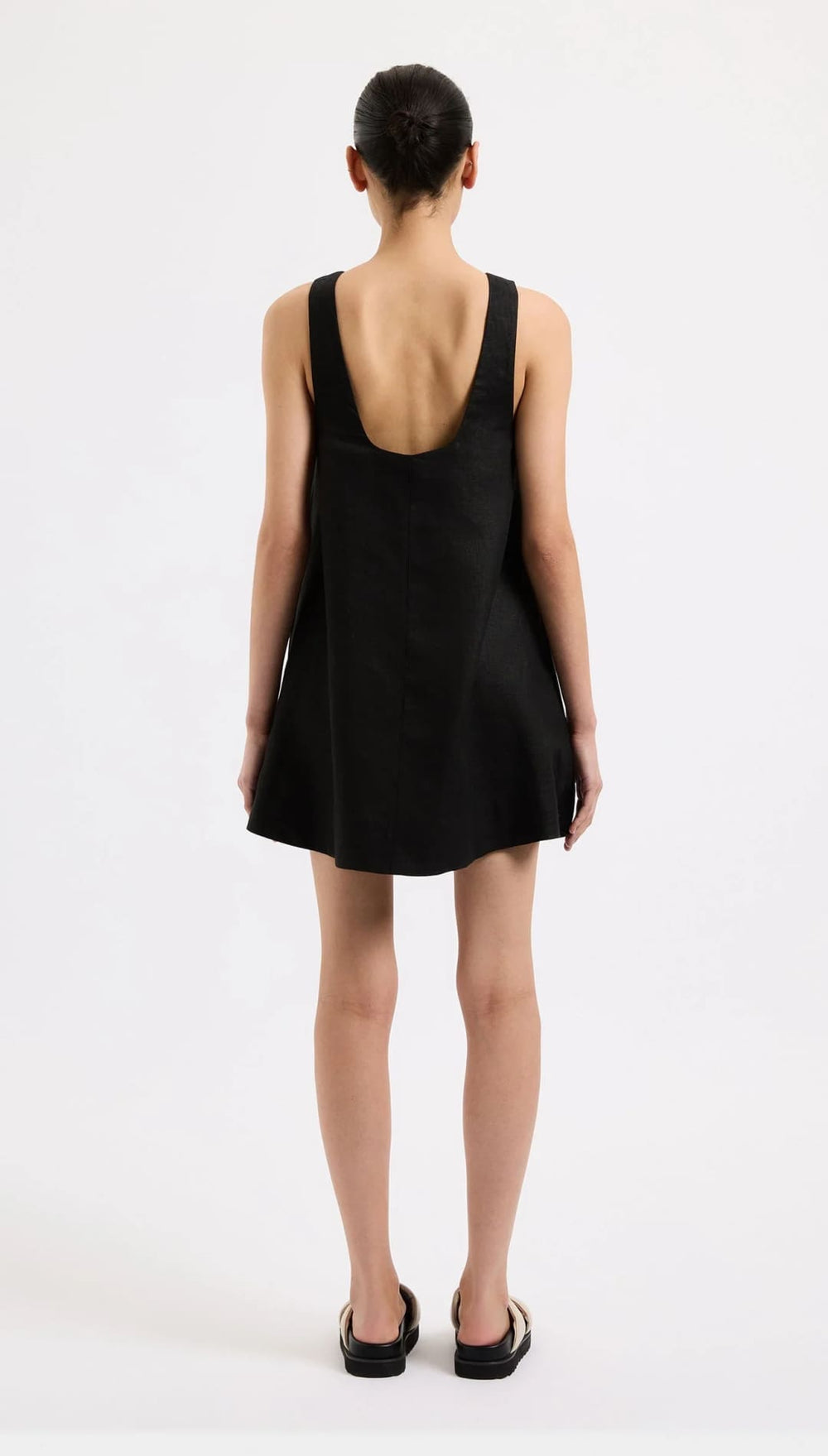 Black sleeveless mini dress.