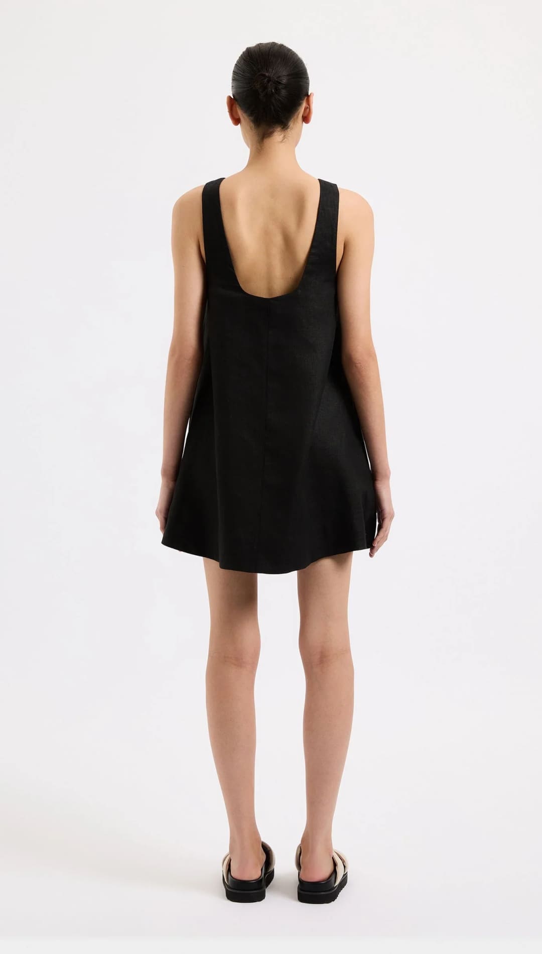 Black sleeveless mini dress.