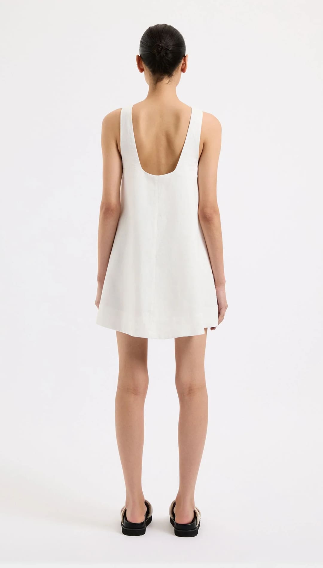 Sleeveless white mini dress.