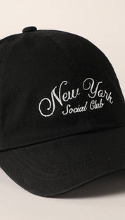 Black cotton baseball cap with white embroidered ’new york social club’ script.