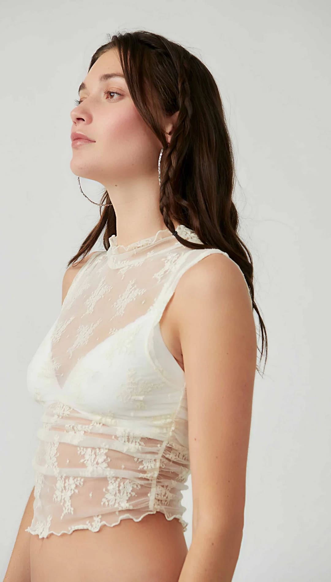 White lace bralette with sheer mesh overlay and floral embroidery.