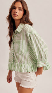 Light green and white vertically striped button-up blouse with ruffled sleeves and hem.