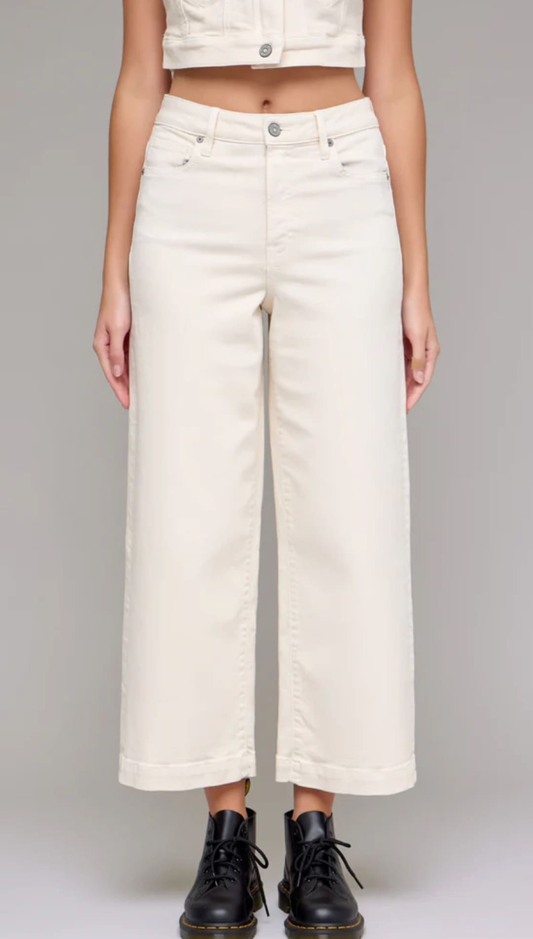 Cream-colored wide-leg pants.