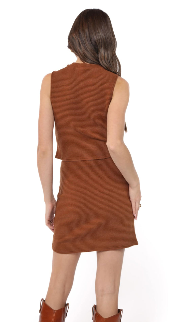 Rust-colored ribbed knit sleeveless top and matching mini skirt.