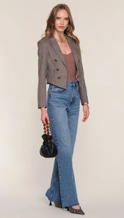Brown tweed double-breasted blazer with flared jeans and leopard print heels.