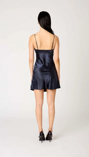 Navy blue satin slip dress with spaghetti straps.