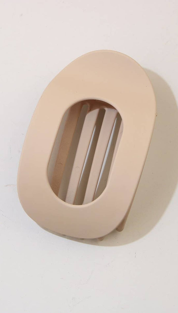 Beige oval-shaped earphone case with a minimalist design and smooth texture.