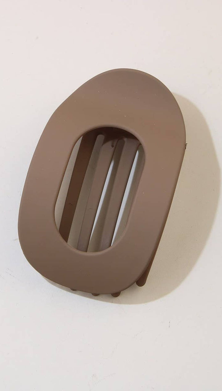 Brown oval-shaped belt buckle with a rectangular cutout design.