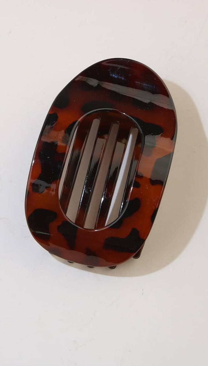 Tortoiseshell hair clip with a glossy finish and sleek design.