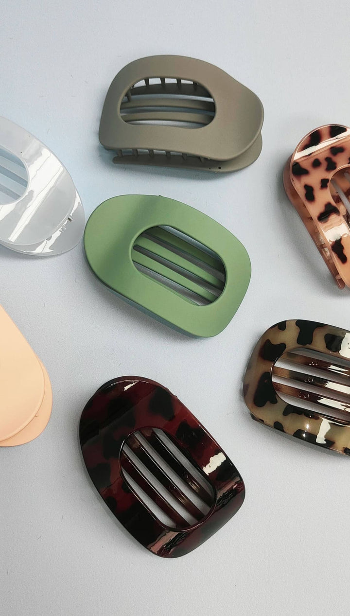 Tortoiseshell hair clip set with metallic accents.