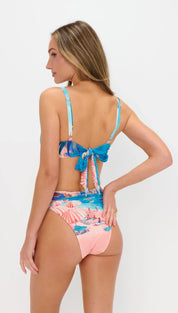 A vibrant pink and blue tropical print bikini set with a back tie detail.