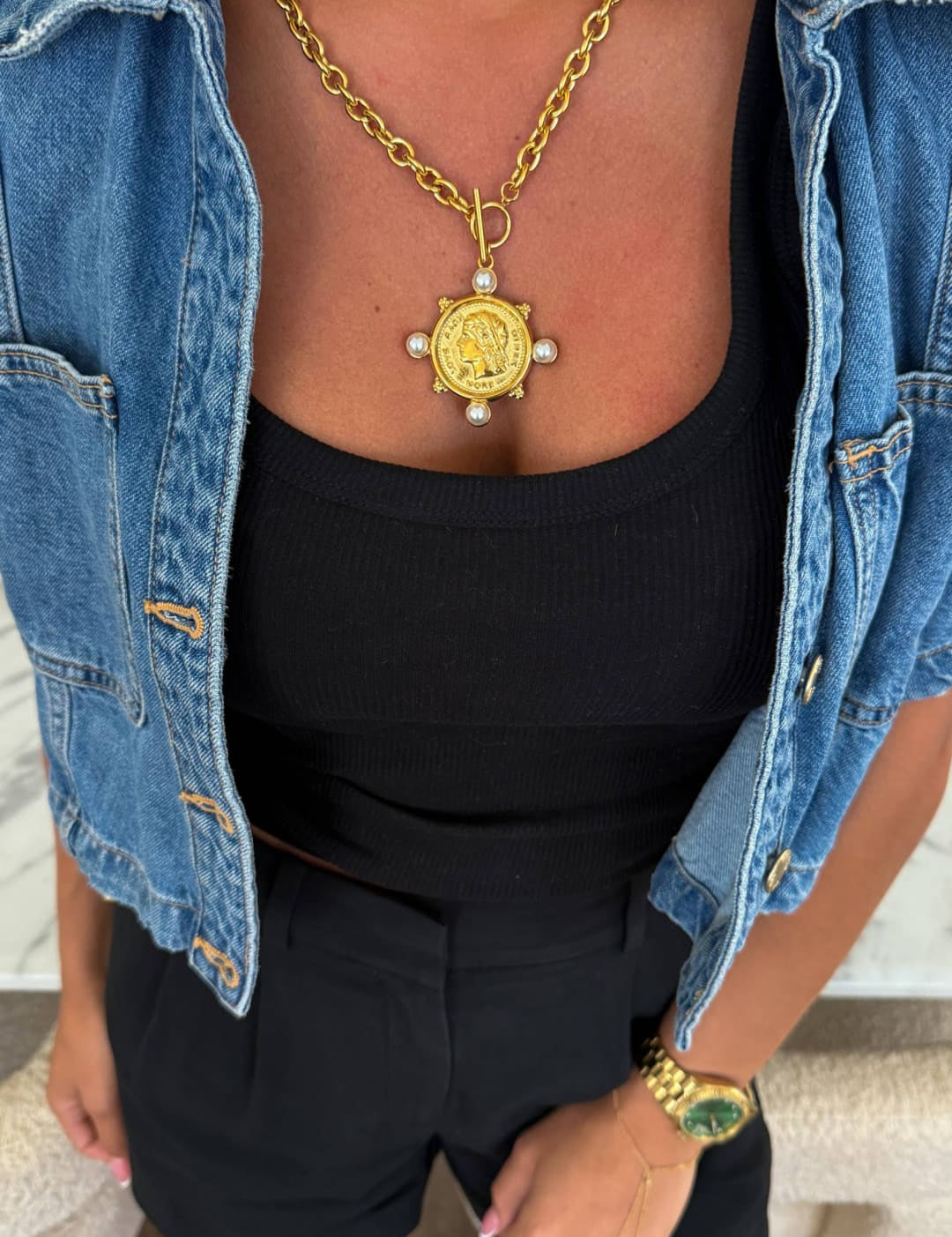 Gold coin pendant necklace with pearl accents and a chunky chain.