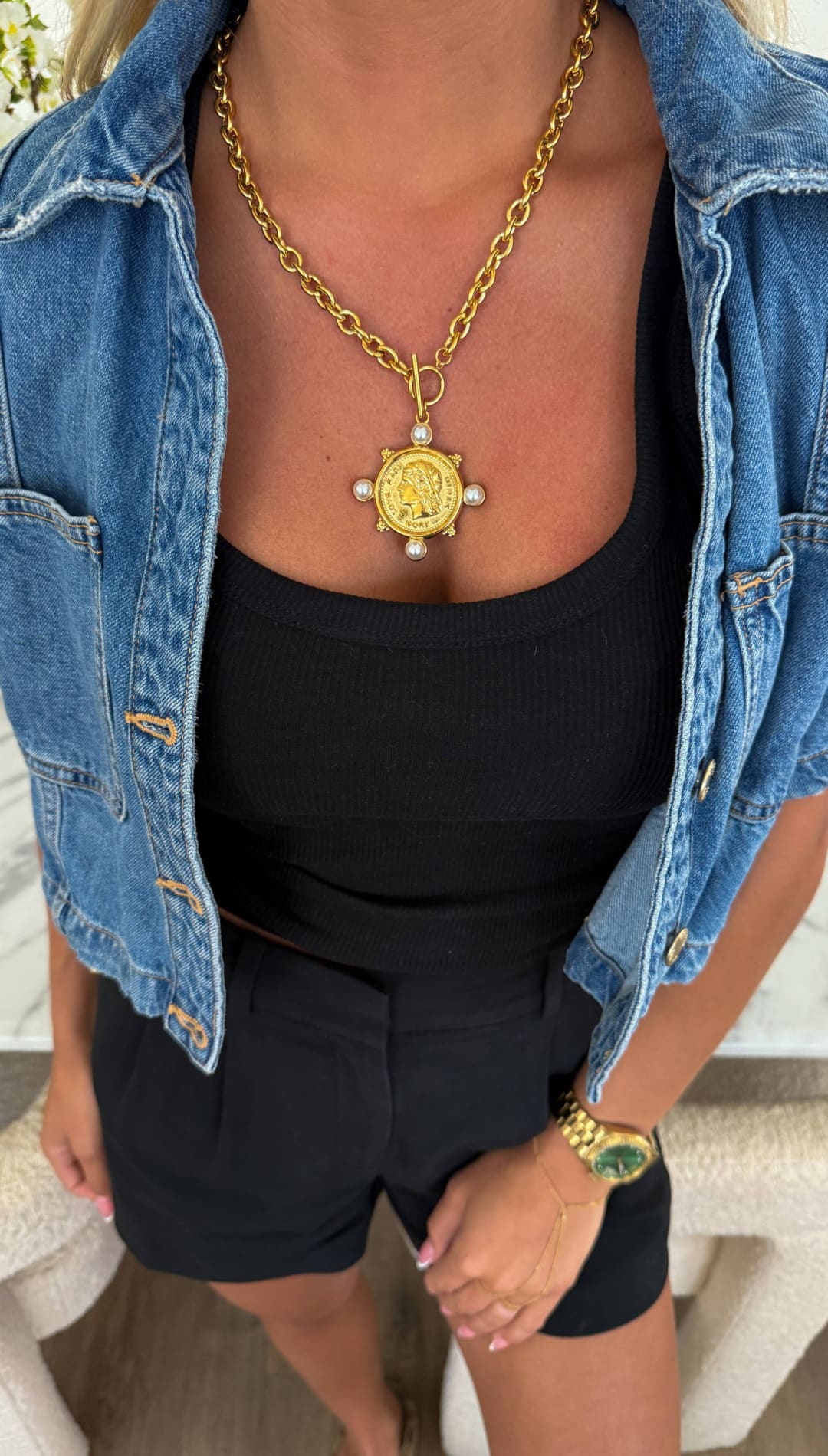 Gold coin pendant necklace with pearl accents and a chunky chain.