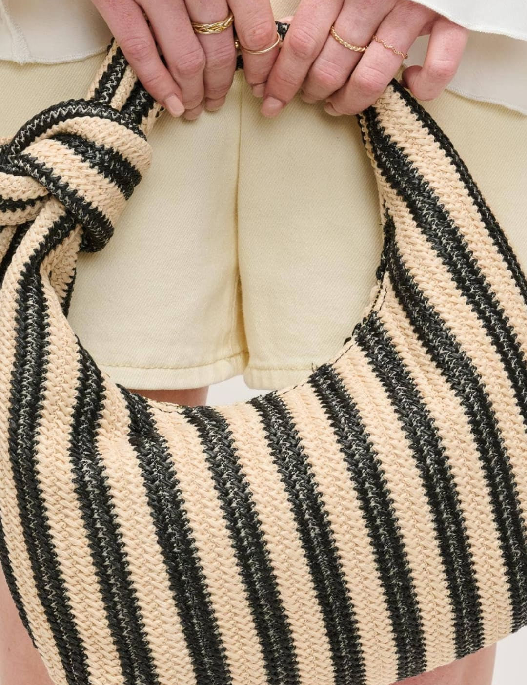 Striped knotted shoulder bag.