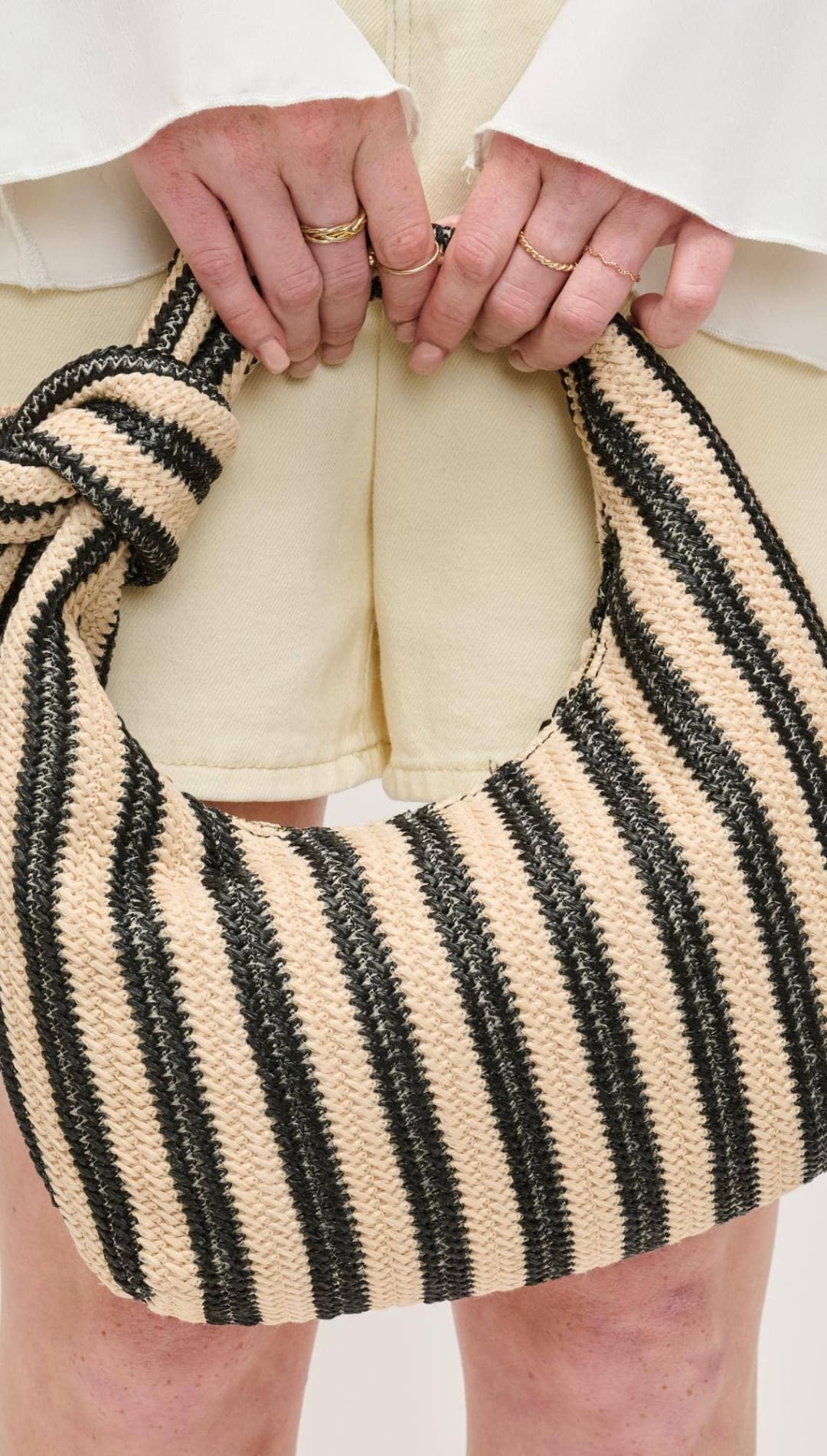 Striped knotted shoulder bag.