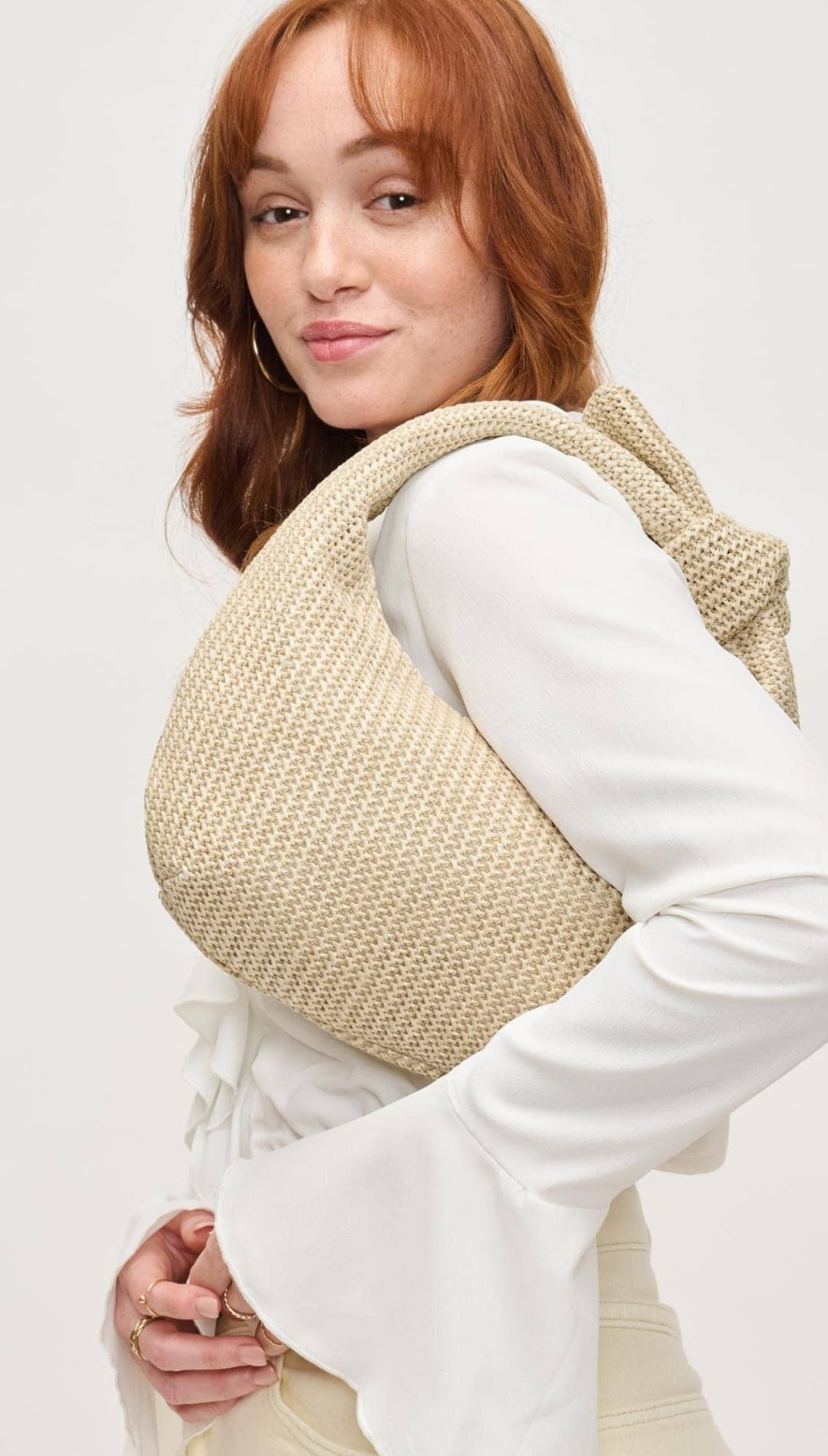 Woven beige shoulder bag.