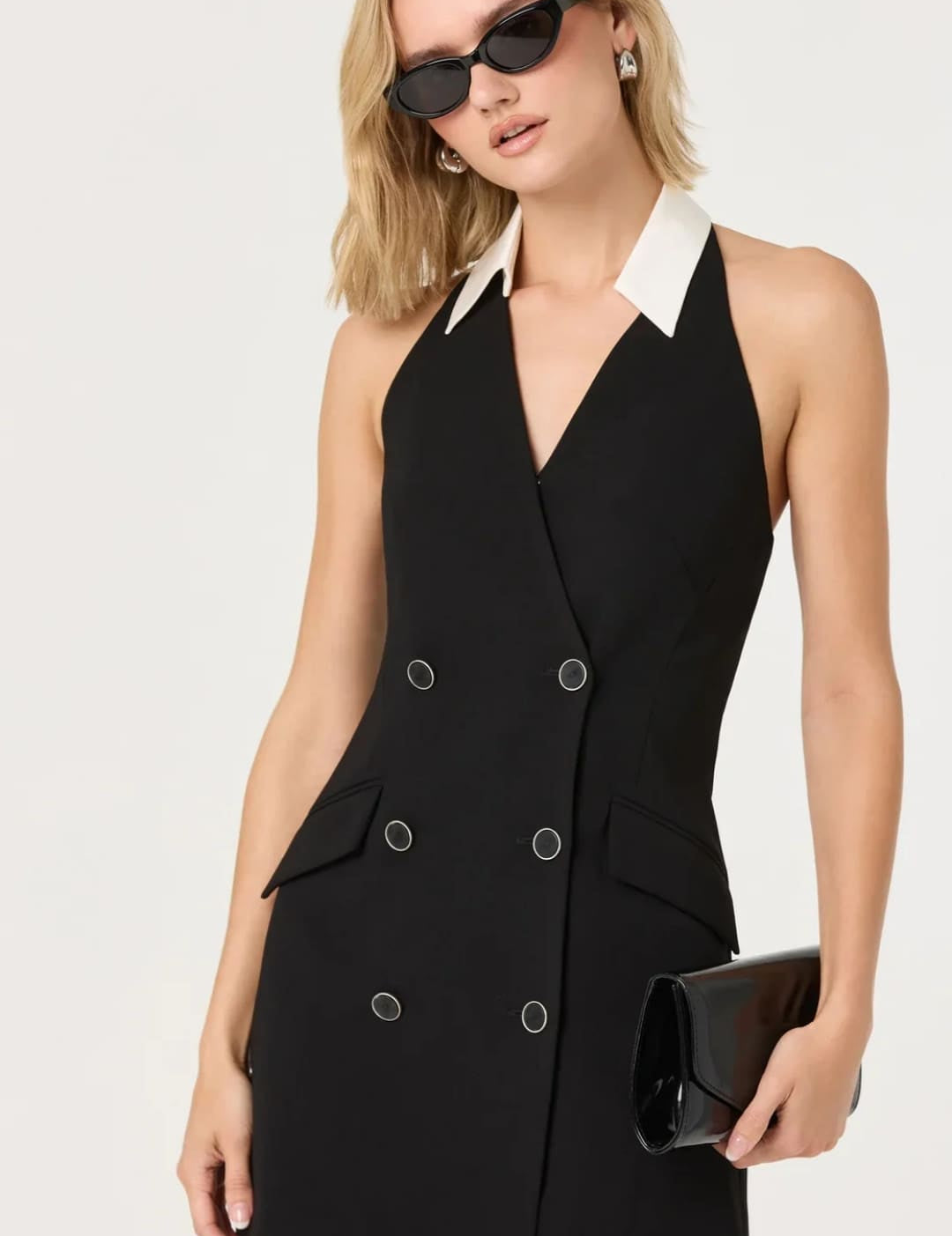 Black double-breasted halter dress with a white collar and silver-toned buttons.