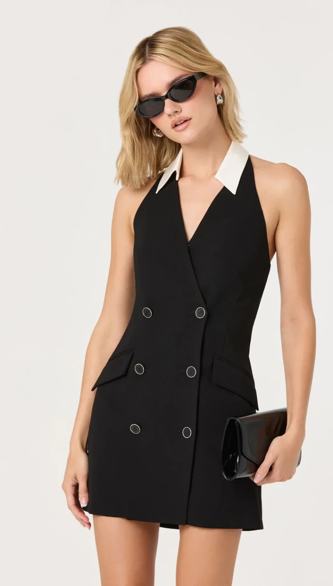 Black double-breasted halter dress with a white collar and silver-toned buttons.