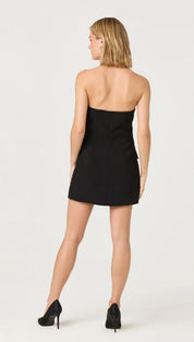 Black strapless mini dress with a fitted bodice and flared skirt.