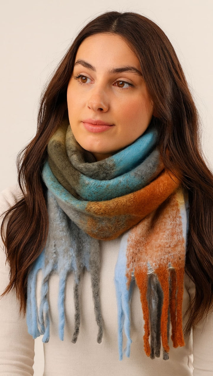 Multicolored scarf with fringe, soft and cozy material.