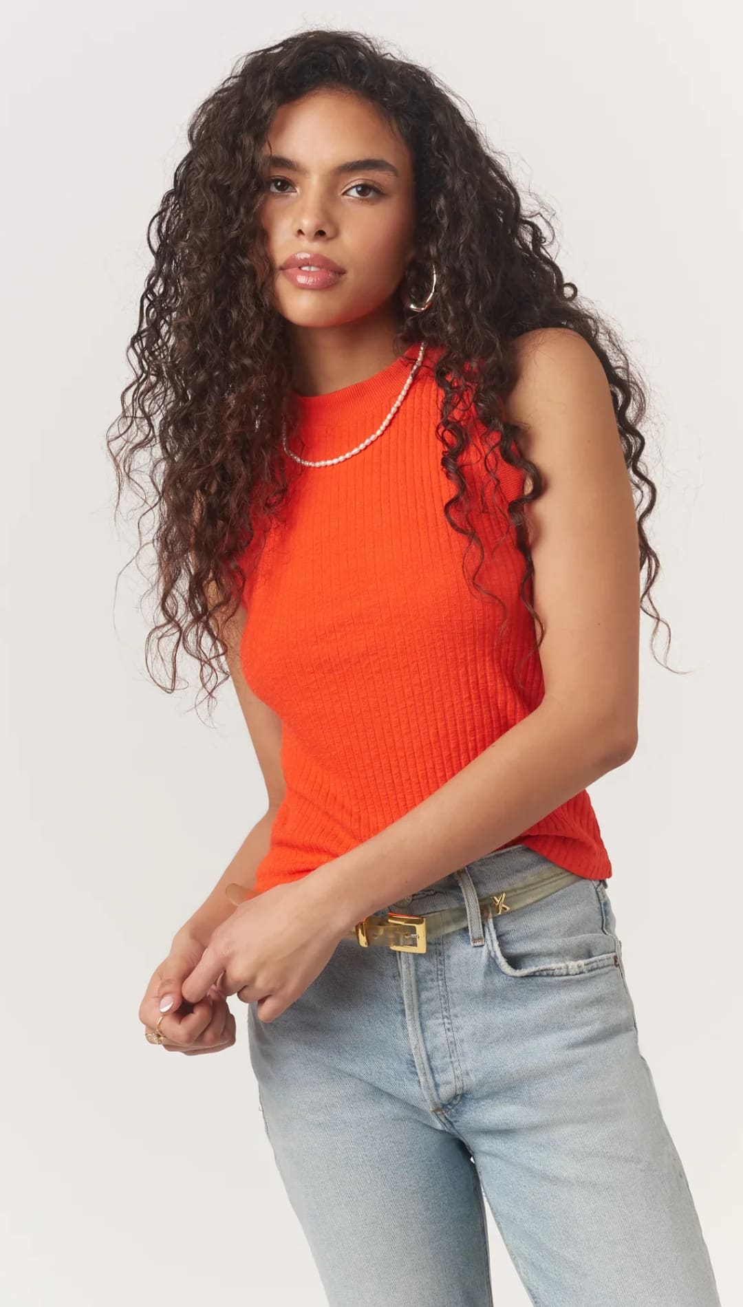 Woman in orange ribbed tank top.