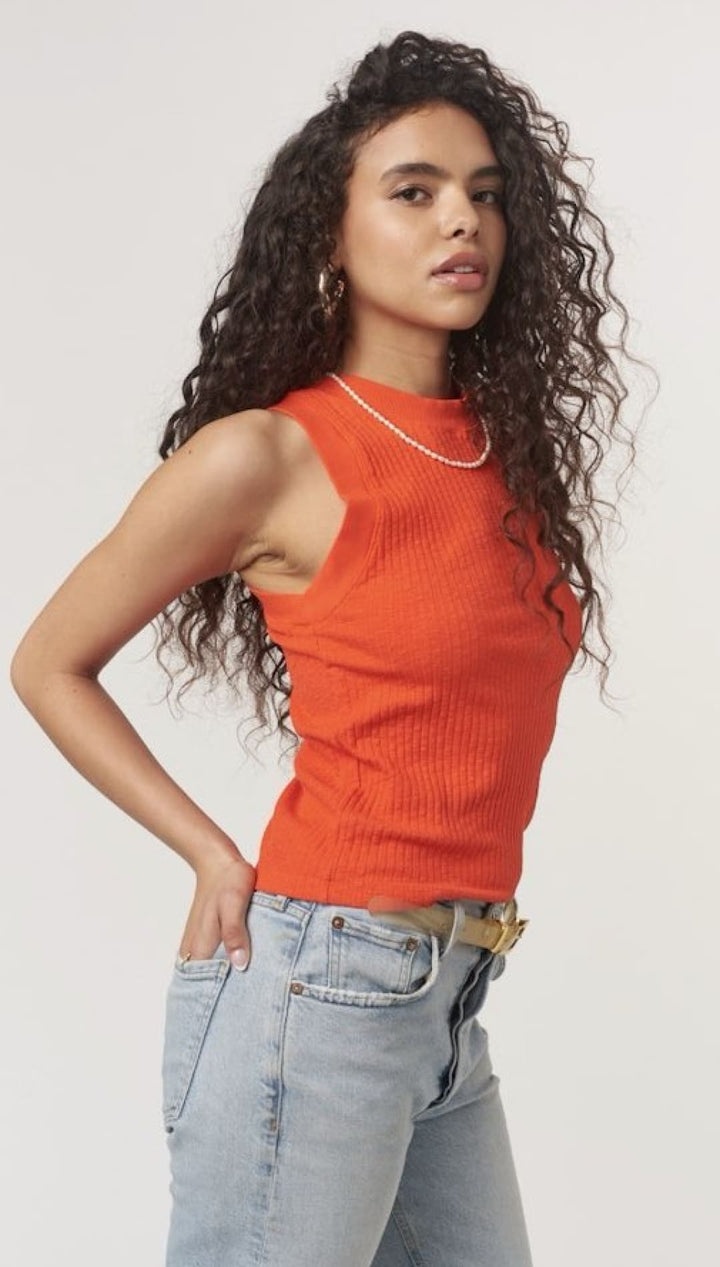 Woman in orange ribbed tank top.