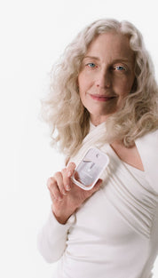 White and silver breast pump