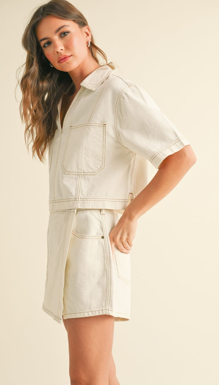 Cream-colored denim short set.