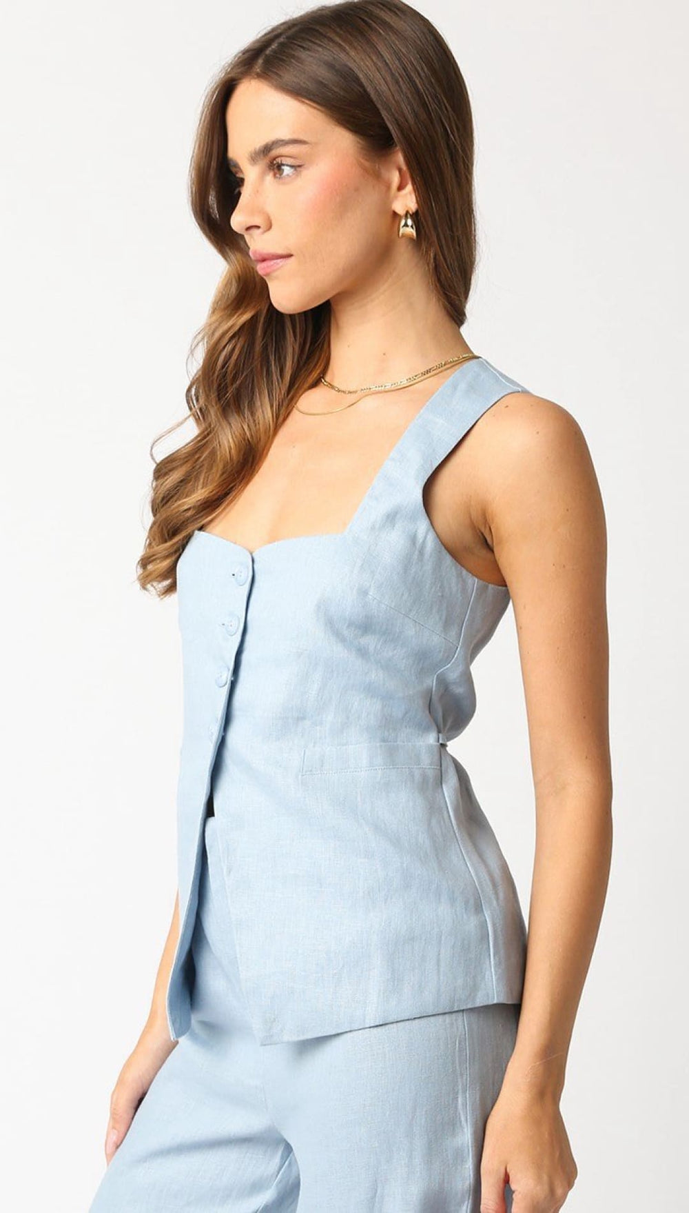 Light blue button-up tank top.