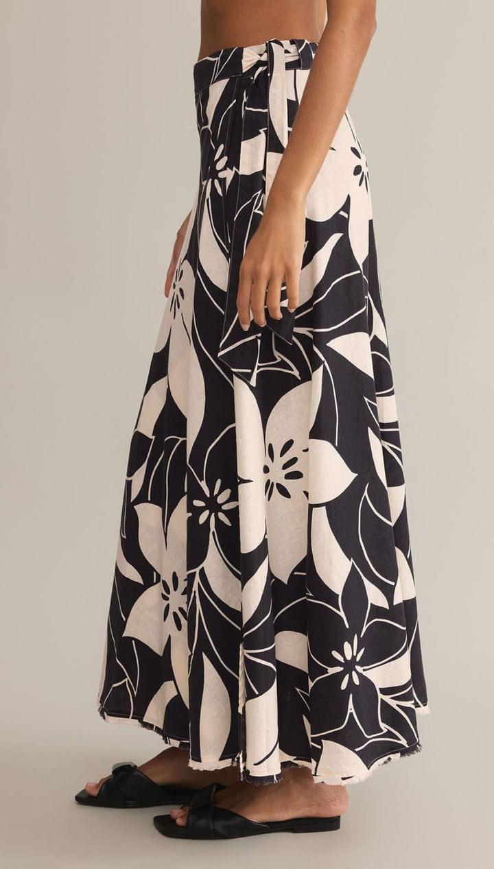 Black and white floral print maxi skirt with a flowing silhouette.