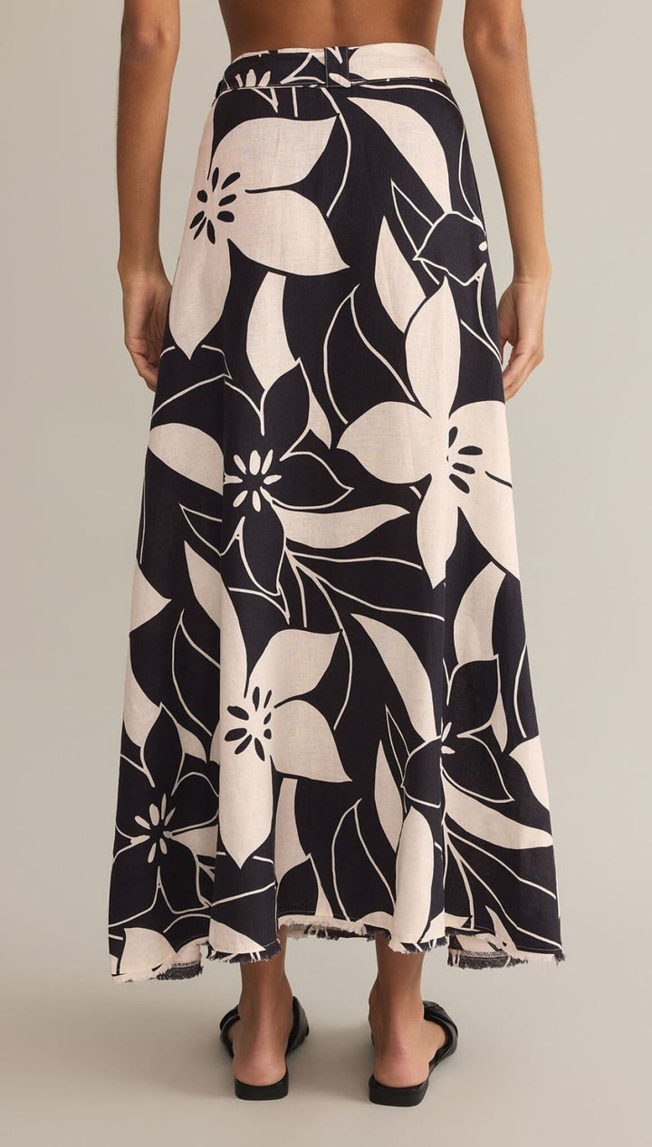 Black and white floral print maxi skirt with a flowing silhouette.