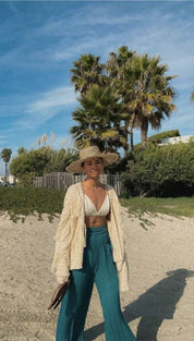 Woman in beach attire.