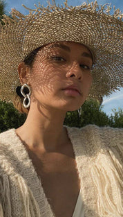 Woman wearing a straw hat.