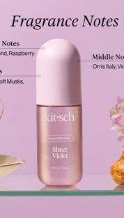 Lavender perfume bottle with white cap, floral design on label.