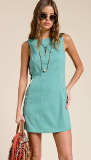 A teal sleeveless a-line dress with a straight neckline and side panel detailing.