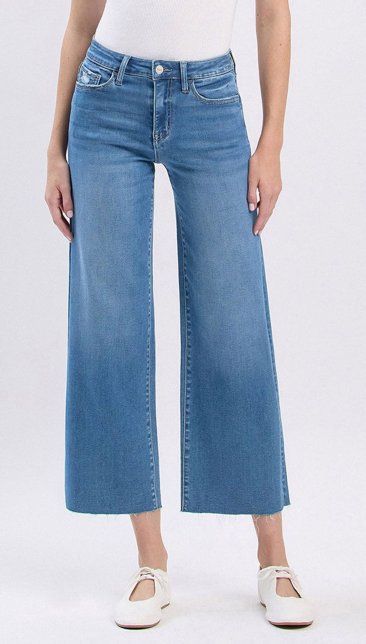 Wide-leg cropped jeans in light blue denim with white stitching and a high waist.