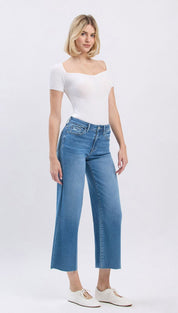 Blue high-waisted jeans with white stitching and a straight leg fit.