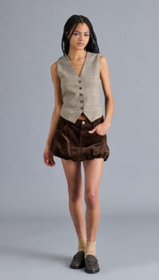 Women’s sleeveless plaid vest with a V-neck and front button closure.