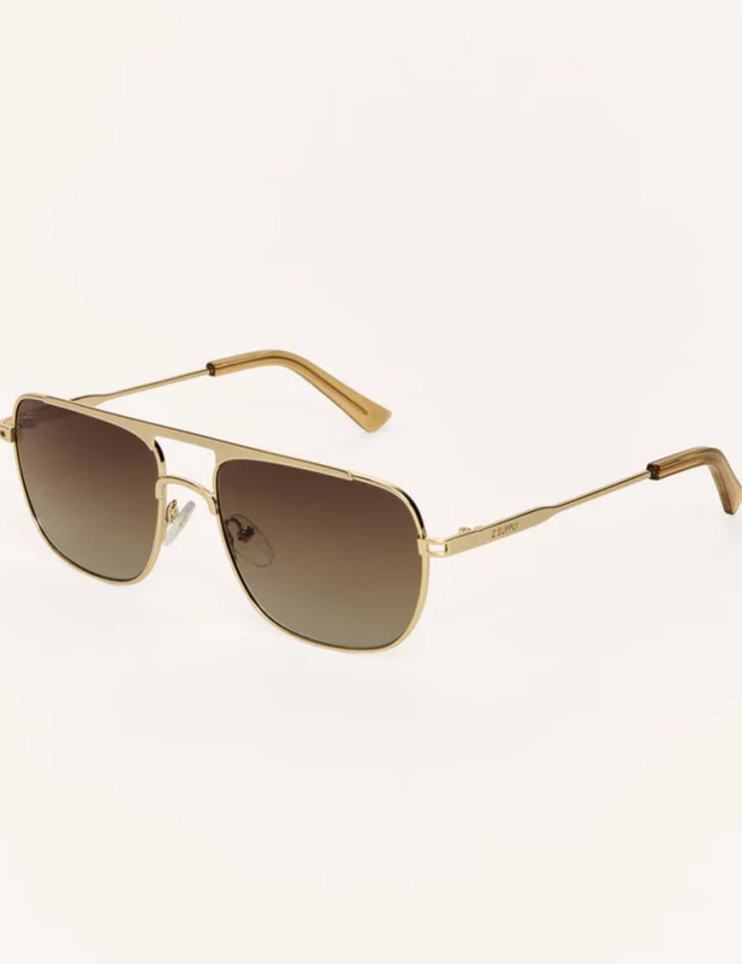 Gold-framed aviator sunglasses with gradient lenses.