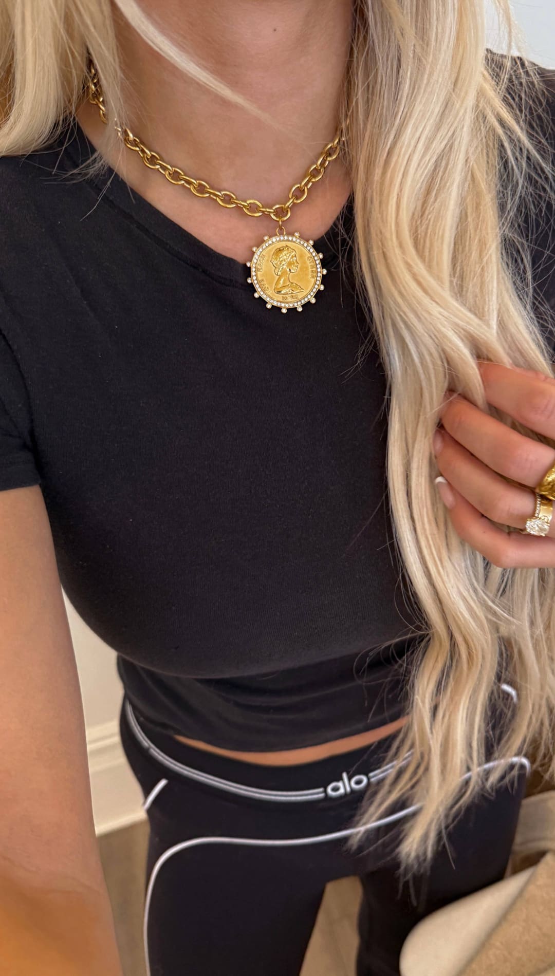 Gold coin pendant necklace with a beaded edge and chain