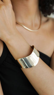 Gold-toned cuff bracelet.