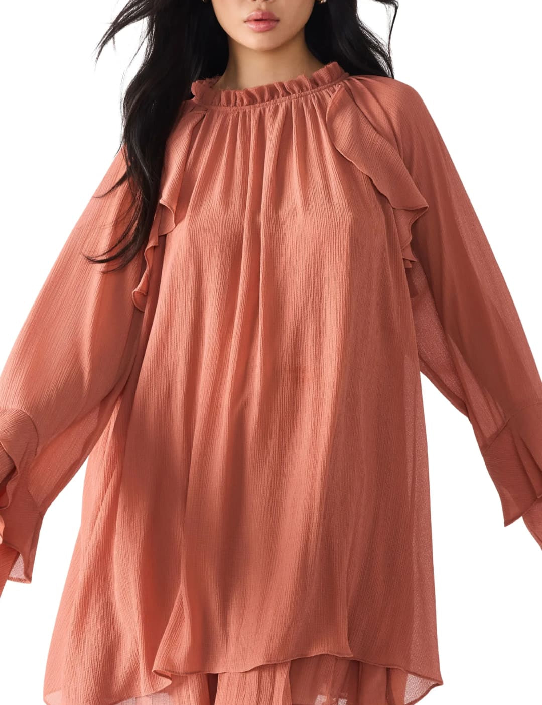 A long-sleeved, ruffled, salmon-colored mini dress.
