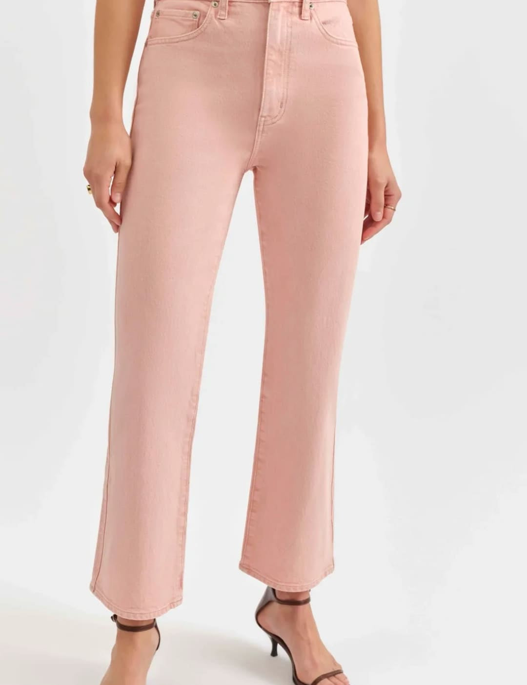 Pink high-waisted cropped jeans.