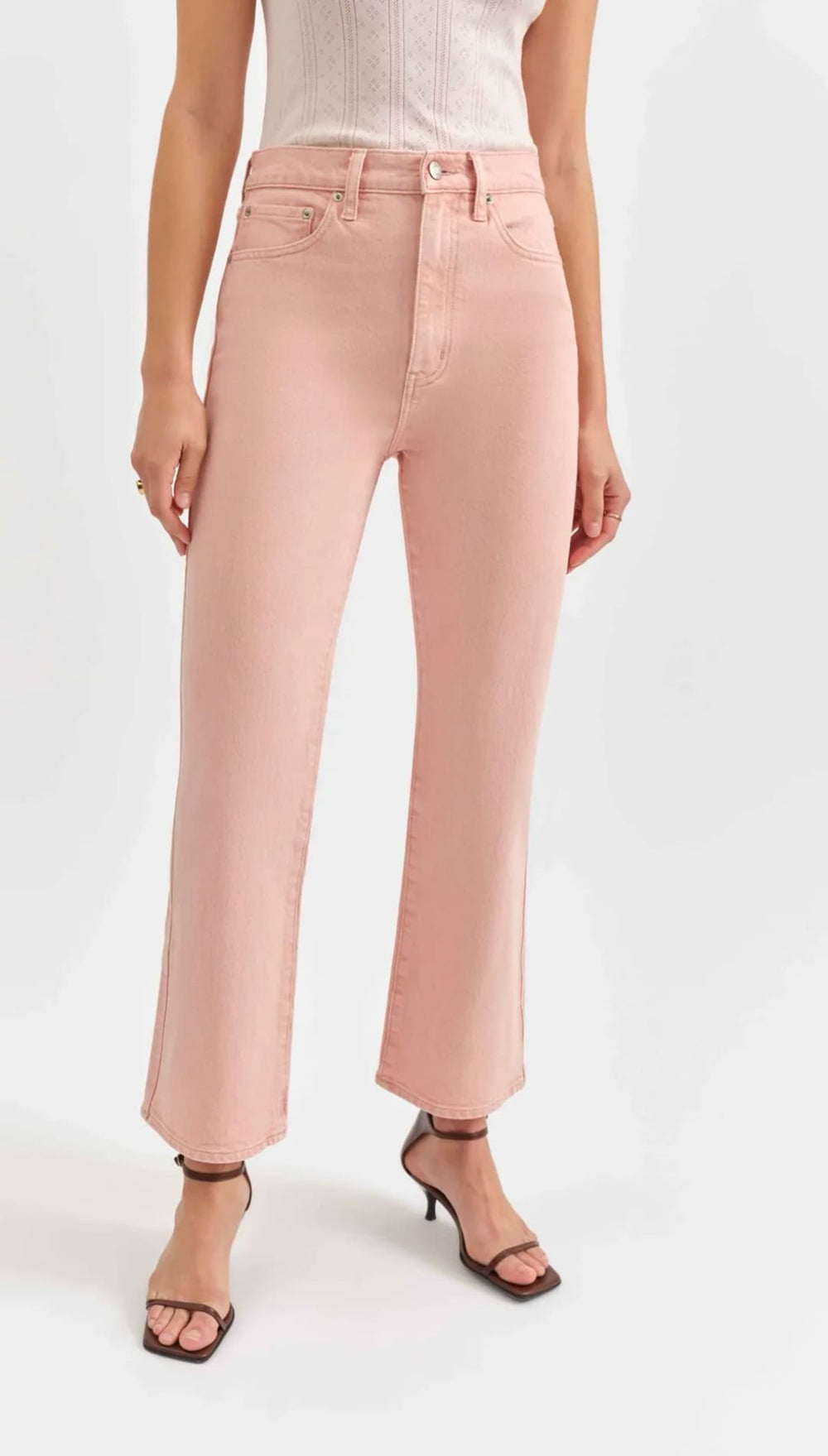 Pink high-waisted cropped jeans.