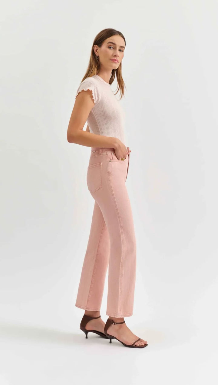 Woman in pink pants and top.