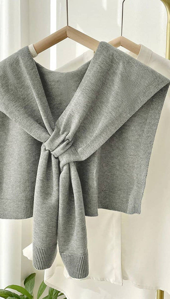Gray knitted shawl with a bow tie design, suitable for women.