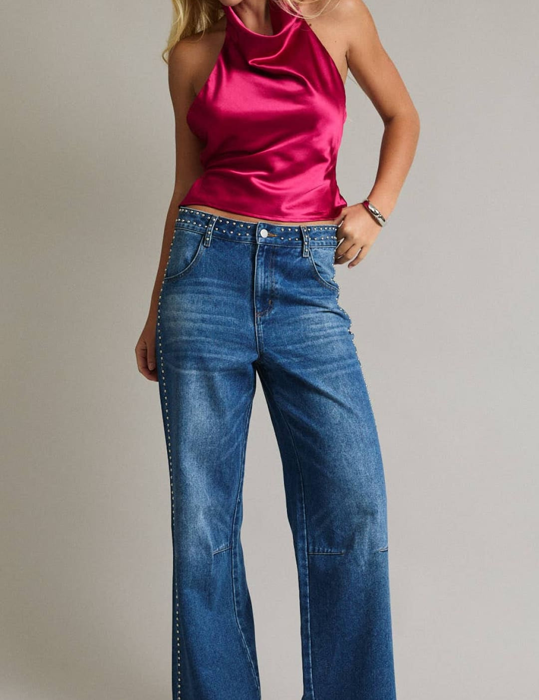 A vibrant fuchsia satin halter top with a sleek, high-neck design.