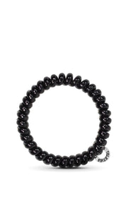 Black beaded bracelet with silver accents and a small logo.