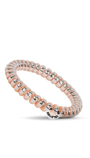 Rose gold beaded stretch bracelet with a small silver charm